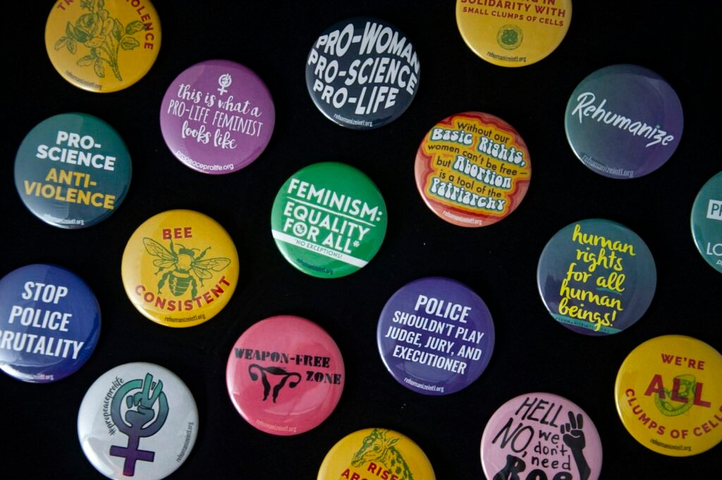 Close up of colorful button pin badges