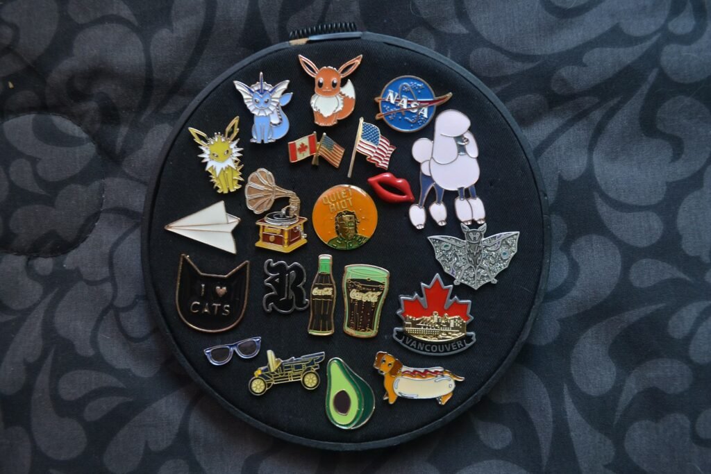 Assorted colorful button pins grouped together