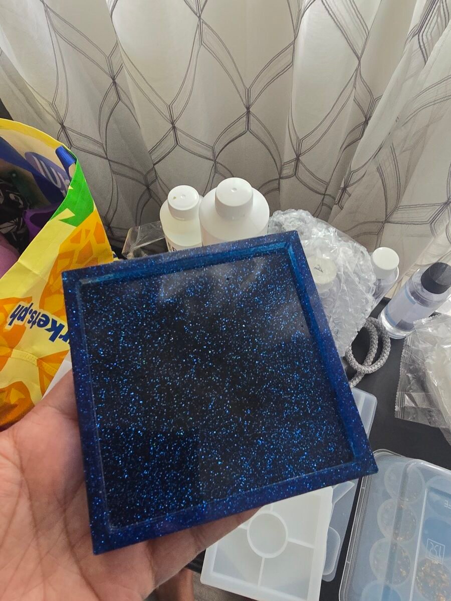 Handmade square resin coaster with sparkling blue galaxy glitter