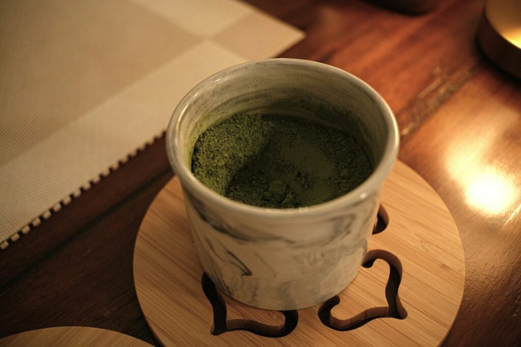 Golden Botanical coaster styled with a warm drink