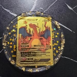 Round resin coaster with a Charizard V trading card and gold flake trim