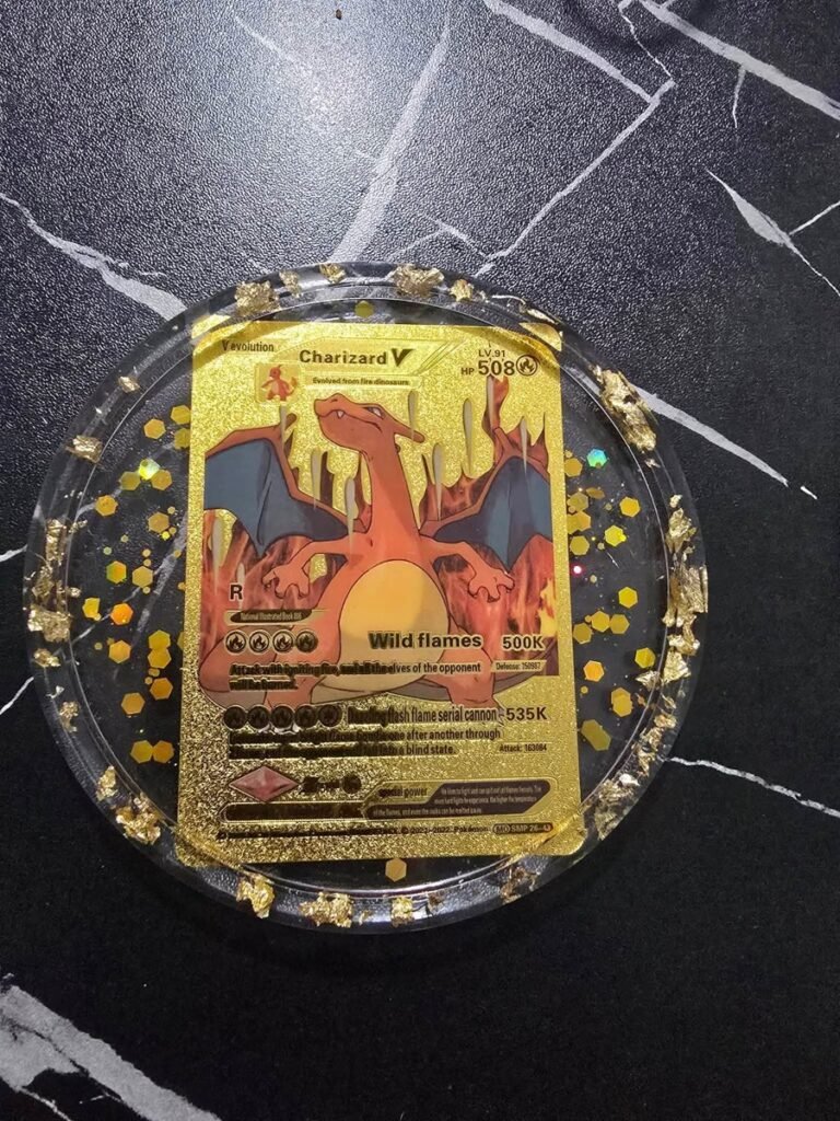 Round resin coaster with a Charizard V trading card and gold flake trim