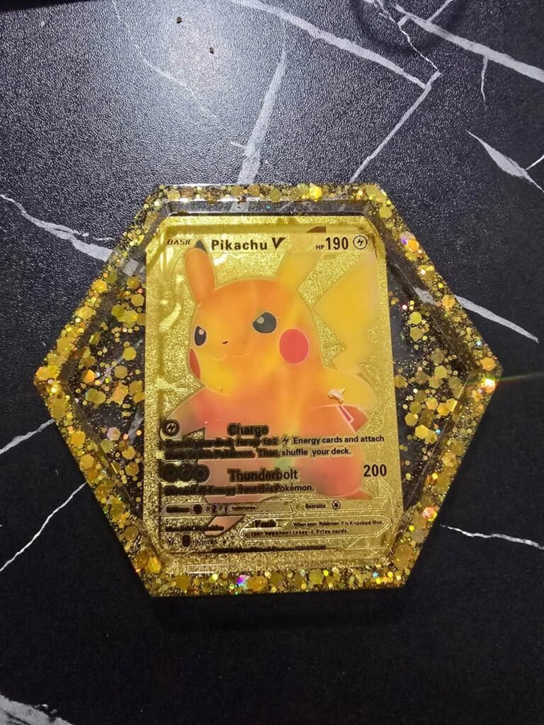 Hexagon resin coaster with a Pikachu V trading card and gold glitter trim